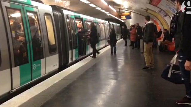 A video grab taken from footage obtained from Guardian News & Media Ltd in the United Kingdom on Feb. 18, 2015 shows Chelsea football fans packed onto a Paris Metro train pushing a passenger to prevent him from boarding the carriage at a station in Paris  