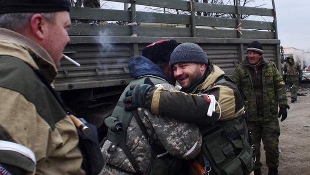 A pro-Russian rebel Cossack, second left, hugs another rebel in Debaltseve, eastern Ukraine, Feb. 19, 2015. 