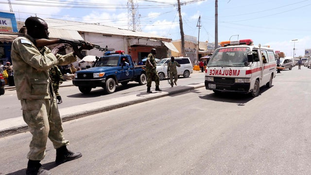 A member of Somali security forces holds his gun as he patrols the streets during an operation against al Shabab militants following the renewed killing of government officers and workers in the capital Mogadishu 