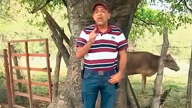 Mexican drug lord Servando "La Tuta" Gomez speaks as he tapes messages in Michoacan in this still image taken from an undated video. 