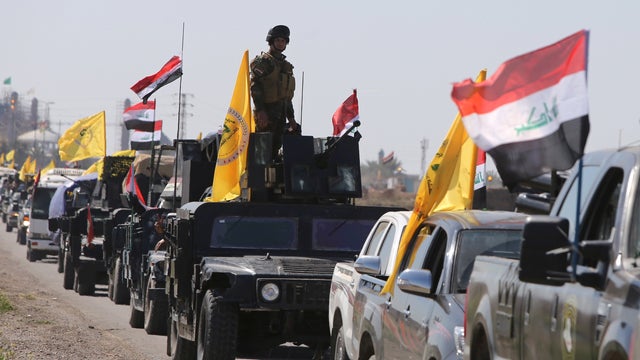 Members of the Iraqi security forces heading from the city of Samarra north of Baghdad drive towards al-Dawr area south of Tikrit to launch an assault against ISIS 