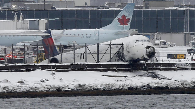 Plane skids off runway at LaGuardia 
