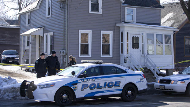 Madison Police investigate the scene of a police-involved shooting at a home in Madison, Wis., March 7, 2015. 