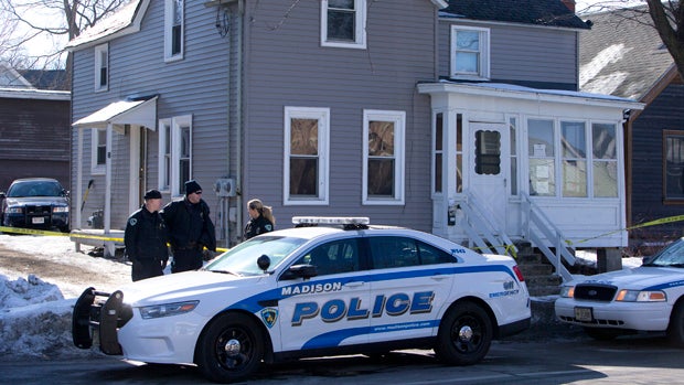 Madison Police investigate the scene of a police-involved shooting at a home in Madison, Wis., March 7, 2015. 