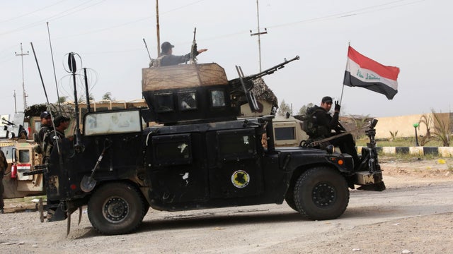 Iraqi security forces prepare to attack ISIS extremists at Camp Speicher, the front line in Tikrit, 80 miles north of Baghdad, Iraq, March 12, 2015. 