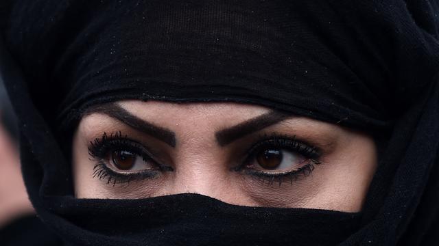 An Afghan protester looks on as demonstrators shout slogans during a rally in front of The Supreme Court in Kabul 