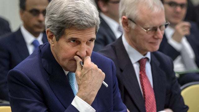 Secretary of State John Kerry waits for the opening of a plenary session of the Iran nuclear talks at the Beau Rivage Palace Hotel in Lausanne 