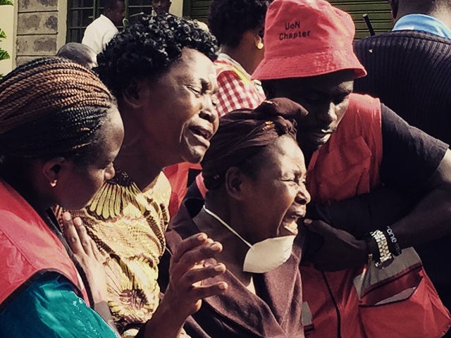 Distraught family members emerge from the Chiromo mortuary in Nairobi, Kenya, April 4, 2015, after identifying loved ones killed in an al-Shabaab massacre at the Garissa University College. 