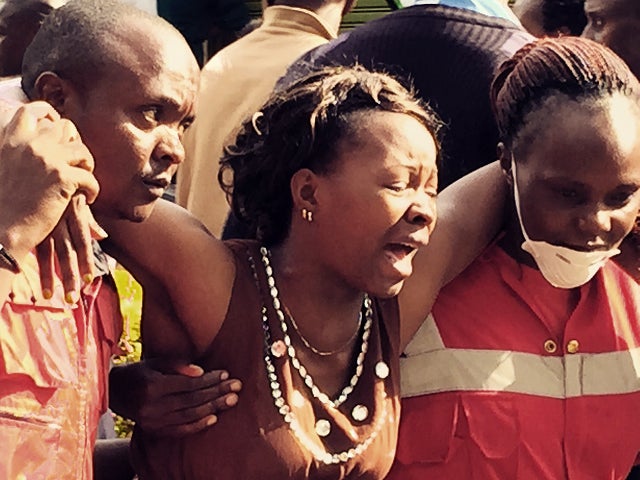 Distraught family members emerge from the Chiromo mortuary in Nairobi, Kenya, April 4, 2015, after identifying loved ones killed in an al-Shabaab massacre at the Garissa University College. 