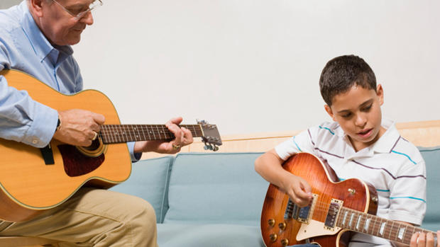 guitar teach child kid thinkstock 