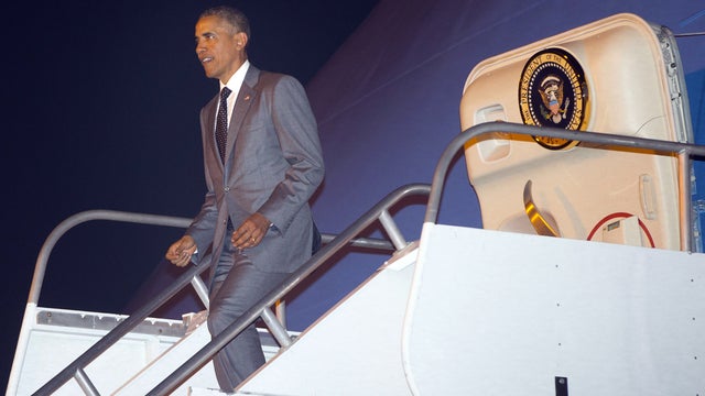 President Obama walking down steps of Air Force One after arriving on April 9, 2015, at Tocumen International Airport in Panama City, Panama 