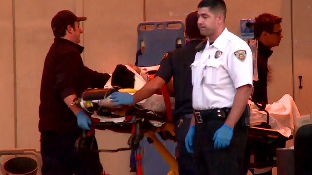 ​An unidentified victim of a shooting in Santa Barbara, Calif. is transported by medics 