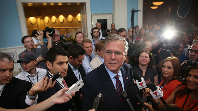 Former Florida Gov. Jeb Bush speaks to the media after addressing Rick Scott's Economic Growth Summit held at Disney's Yacht and Beach Club Convention Center June 2, 2015, in Orlando, Florida. 