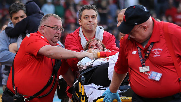 A fan is attended to by medical staff after she was hit by a broken bat during a game between the Boston Red Sox and the Oakland Athletics in the second inning at Fenway Park June 5, 2015, in Boston, Massachusetts. 
