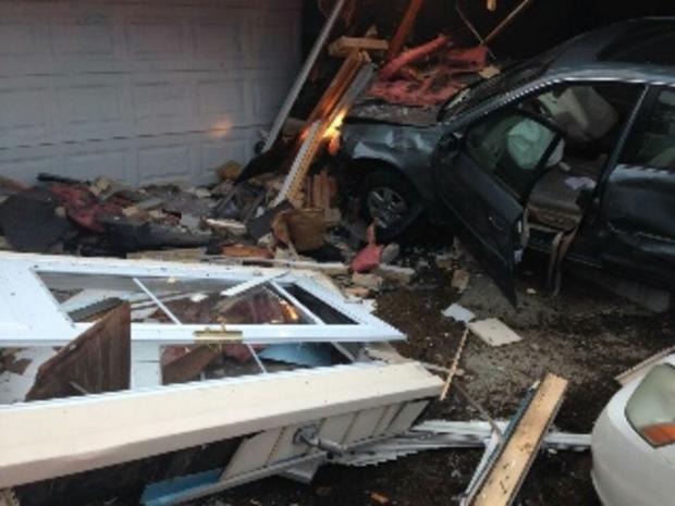 Car crashes into Shelby Township home 