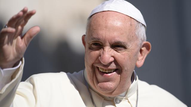 ​Pope Francis greets the crowd as he arrives for his general audience at St Peter's square 