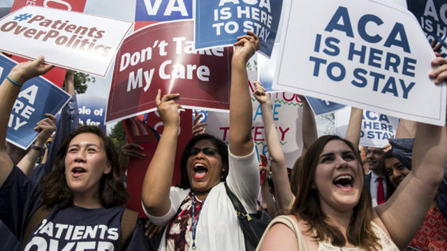 Supporters of the Affordable Care Act celebrate after the Supreme Court upheld the law in a 6-3 vote at the Supreme Court in Washington June 25, 2015. 