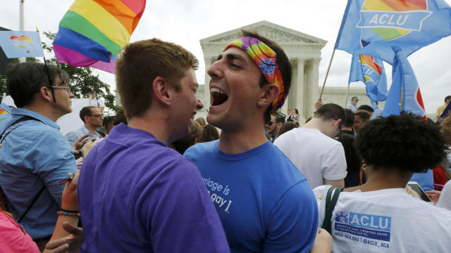 Gay rights supporters celebrate after the U.S. Supreme Court ruled that the Constitution provides same-sex couples the right to marry, outside the Supreme Court building in Washington June 26, 2015. 