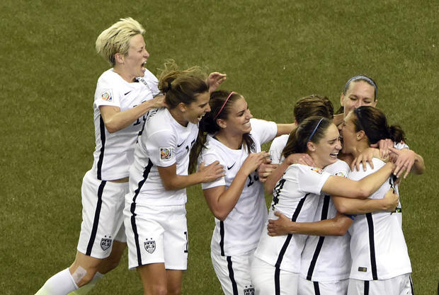 United States midfielder Carli Lloyd (10) celebrates with teammates after scoring on a penalty kick against Germany during the second half of the semifinals of the FIFA 2015 Women's World Cup at Olympic Stadium. 