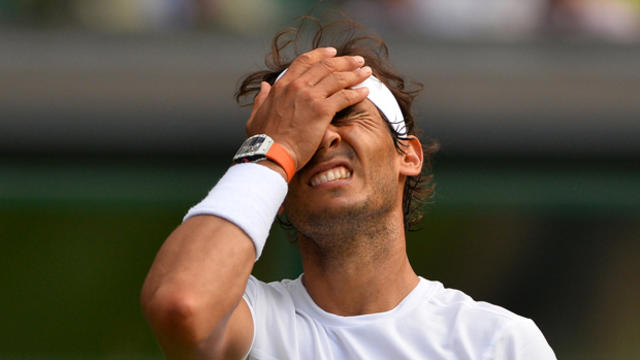 Spain's Rafael Nadal reacts after a point against Germany's Dustin Brown during their men's singles second round match on day four of the 2015 Wimbledon Championships at The All England Tennis Club in Wimbledon, southwest London, July 2, 2015. 