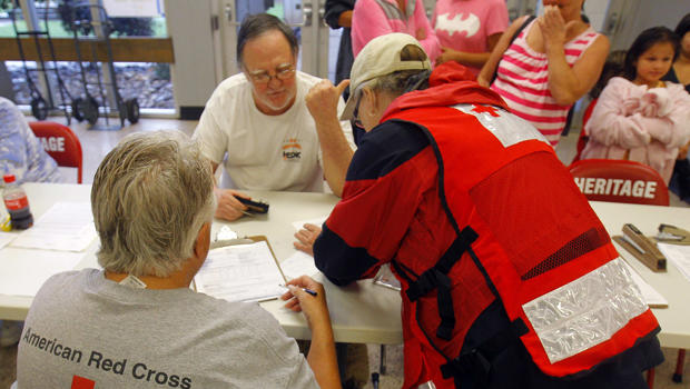 Evacuee Nathan Worley gets assistance from Red Cross volunteers after a train derailment near Maryville, Tennessee, July 2, 2015. 