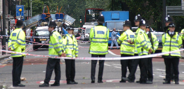 Police block access to a double-deck bus that was destroyed after a terrorist bomb exploded on it near Tavistock Square in London 