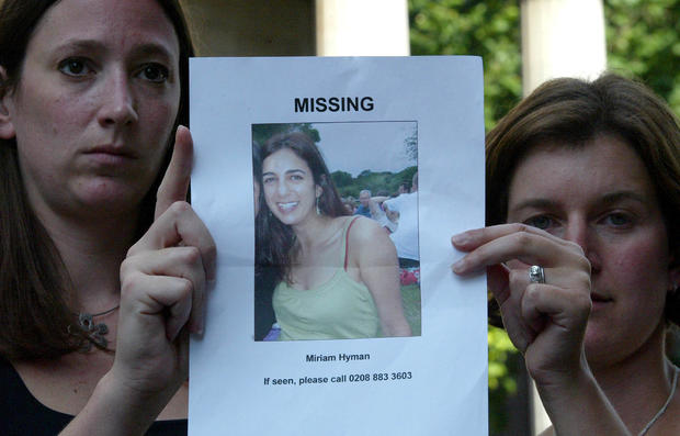 Melissa Lehrer, left, and Sarah Lyons, right, hold a print out of missing friend Miriam Hyman: it was later discovered that she was killed in the Travistock Square bombing, London 