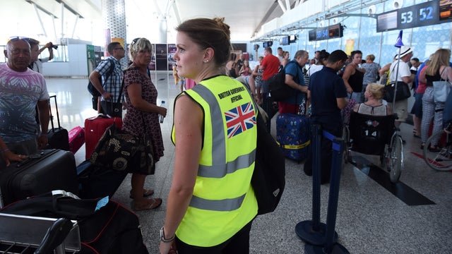 British tourists queue up at the check-in counter at the Enfidha International airport in the Tunisian capital Tunis 