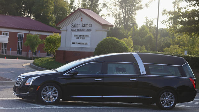 The hearse containing the casket of Bobbi Kristina Brown arrives at the St. James United Methodist Church Aug. 1, 2015, in Alpharetta, Georgia. 
