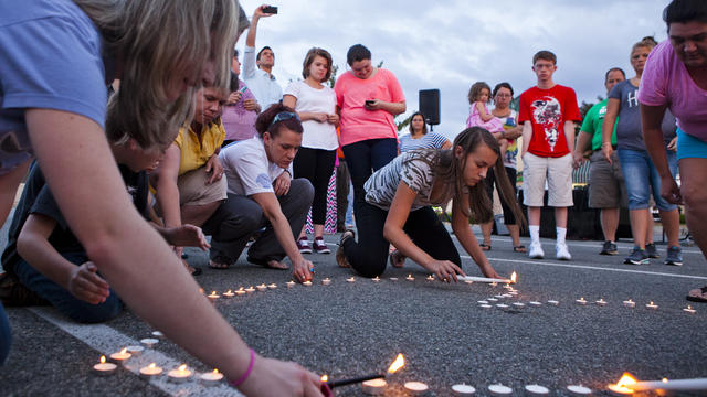 Community members light a heart-shaped ring of candles during a prayer vigil organized by Vitalize Church in Hardy, Virginia, for the WDBJ journalists who were fatally shot Aug. 26, 2015. 