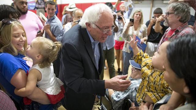 Democratic presidential candidate Sen. Bernie Sanders, D-Vermont, greets Sarah Young Bear-Brown and her son Maddox Tubby after talking to tribal members of the Sac and Fox Tribe of the Mississippi in Iowa/Meskwaki Nation during a campaign event at the Mes 