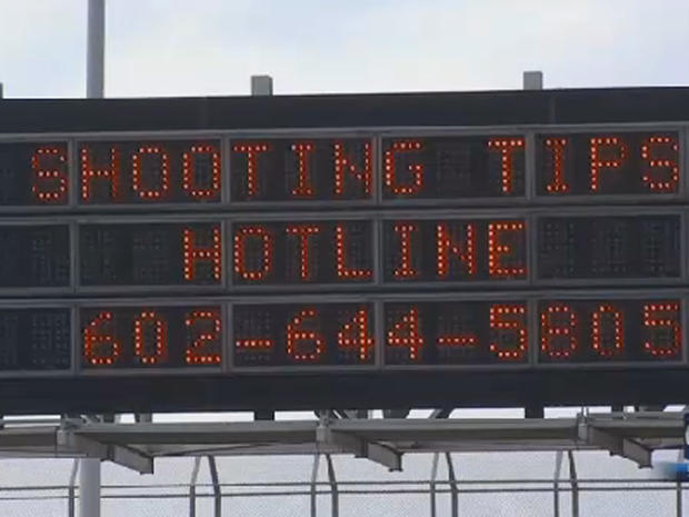 Highway sign is seen in Phoenix on September 9, 2015 uring people to call in tips as authorities pressed their investigation into a series of incidents on city highways in which windows of passing vehicles were shot out 