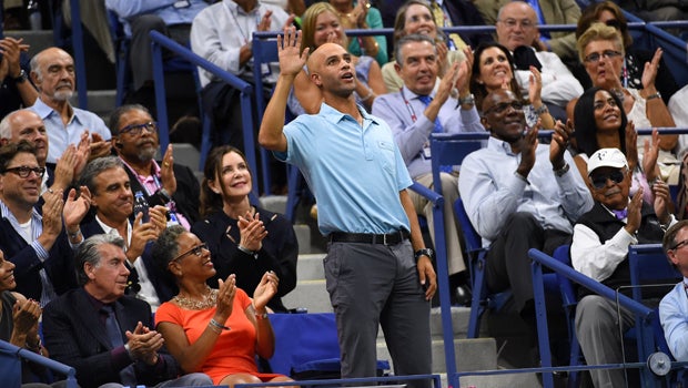 Former tennis player James Blake acknowledges the crowd during the match between Roger Federer of Switzerland and Stan Wawrinka of Switzerland on day 12 of the 2015 U.S. Open tennis tournament at USTA Billie Jean King National Tennis Center in New York.