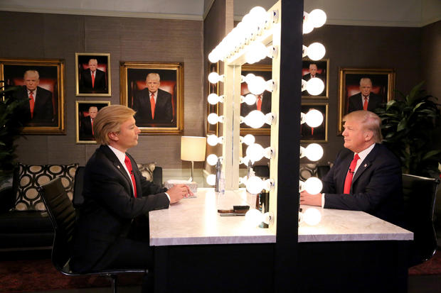 In this image released by NBC, host Jimmy Fallon, left, and Republican presidential candidate Donald Trump appear in the "Trump in the Mirror" skit during a taping of "The Tonight Show" Sept. 11, 2015, in New York. 
