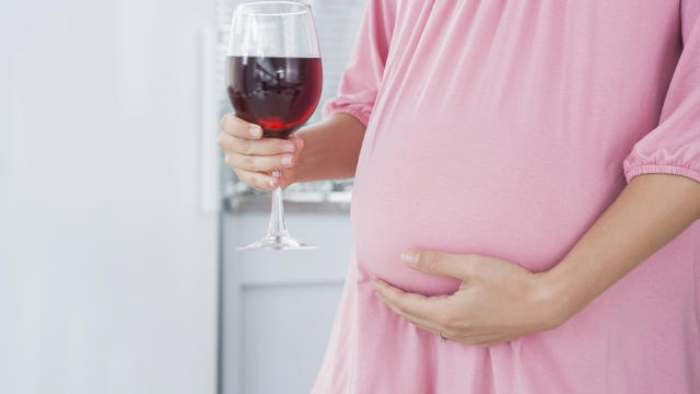 pregnant woman glass of wine.jpg 