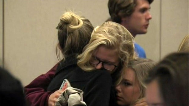 ​Two women embrace before Northern Arizona University officials hold a press conference on a deadly shooting on the campus in Flagstaff, Arizona, Oct. 9, 2015. 
