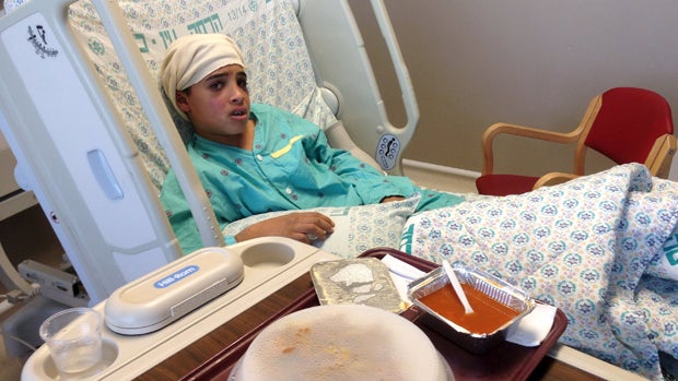 ​Thirteen-year-old Ahmed Manasra, a Palestinian from Beit Hanina in northern Jerusalem, sits in his hospital bed at Hadassah Hospital in Jerusalem in this handout picture released from the Israeli Government Press Office (GPO) Oct. 15, 2015. 