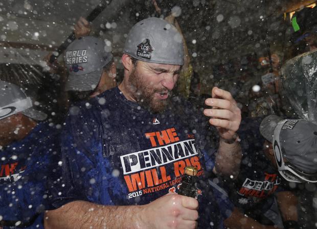 New York Mets second baseman Daniel Murphy celebrates with champagne in clubhouse after Mets defeating Chicago Cubs to win NLCS at Wrigley Field on October 21, 2015 and advance to World Series 