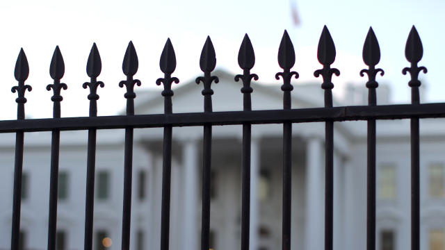 The White House is seen through the North Lawn perimeter fence in Washington Sept. 23, 2014. 