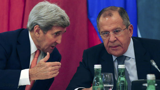 U.S. Secretary of State John Kerry, left, talks to Russian Foreign Minister Sergey Lavrov during a photo opportunity before a meeting in Vienna, Austria, Oct. 30, 2015. 