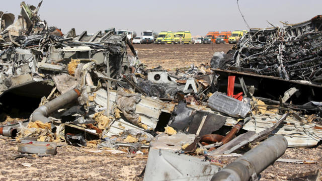 The remains of a Russian airliner are seen as rescue crews wait at the crash site in al-Hasanah in El Arish, Egypt, Nov. 1, 2015. 