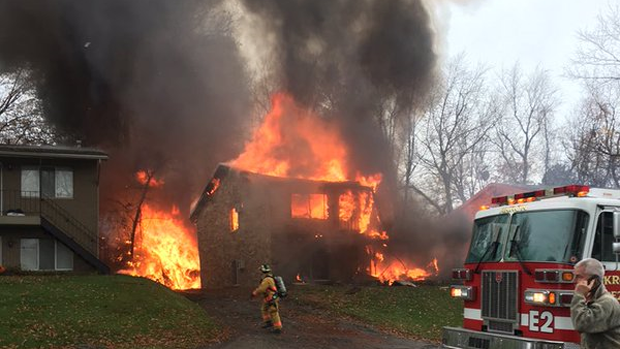 Crews work the scene after a small business jet crashed into an apartment building in Akron, Ohio, Nov. 10, 2015. 