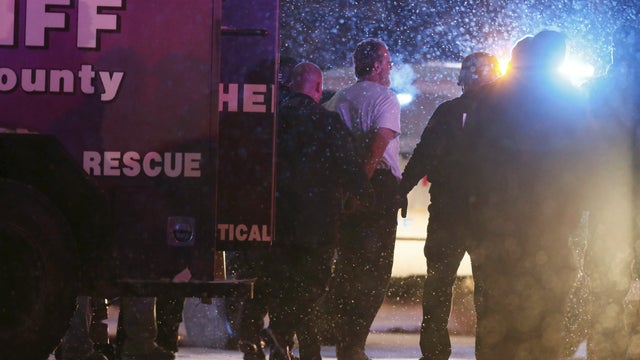A suspect, identified as Robert Lewis Dear of North Carolina, is taken into custody outside a Planned Parenthood center in Colorado Springs, Colorado, Nov. 27, 2015. 