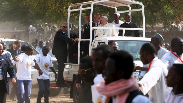 Pope Francis greets residents of the mostly Muslim PK 5 neighbourhood in the capital Bangui, Central African Republic 