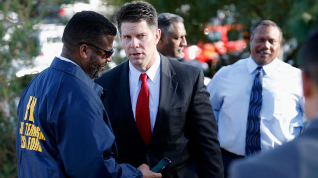 Assistant Director in Charge of FBI Los Angeles David Bowdich, center, speaks with members of law enforcement regarding the shooting that occurred at the Inland Regional Center on Dec. 2, 2015, in San Bernardino, California. 