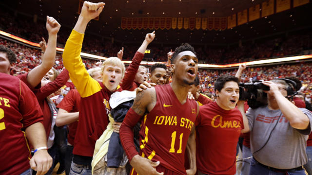 Monte Morris, No. 11 of the Iowa State Cyclones, celebrates with fans after he sank the winning basket to defeat the Iowa Hawkeyes 83-82 at Hilton Coliseum Dec. 10, 2015, in Ames, Iowa. 