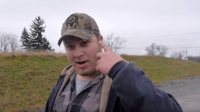 ​A Pennsylvania man identified by news outlets as John Pisone gestures toward a black cameraman in a video posted to YouTube Dec. 27, 2015. 