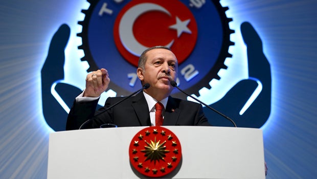 Turkey's President Recep Tayyip Erdogan addresses the audience during a meeting in Ankara, Turkey, Dec. 3, 2015. 