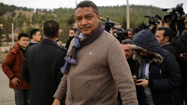 The U.N.'s humanitarian coordinator for Syria, Yacoub El Hillo, looks on after talking to journalists as a convoy of aid from the Syrian Arab Red Crescent waits on the outskirts of the besieged rebel-held Syrian town of Madaya Jan. 14, 2016. 