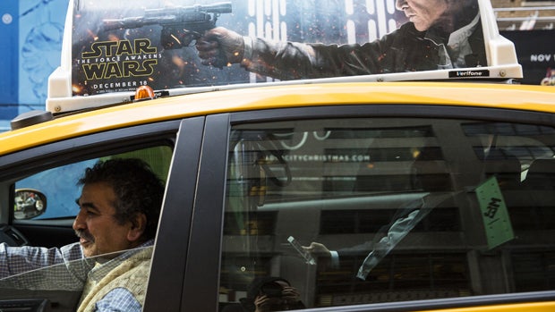 A "Star Wars: The Force Awakens" advertisement is seen on top of a taxi on Dec. 11, 2015, in New York City. 